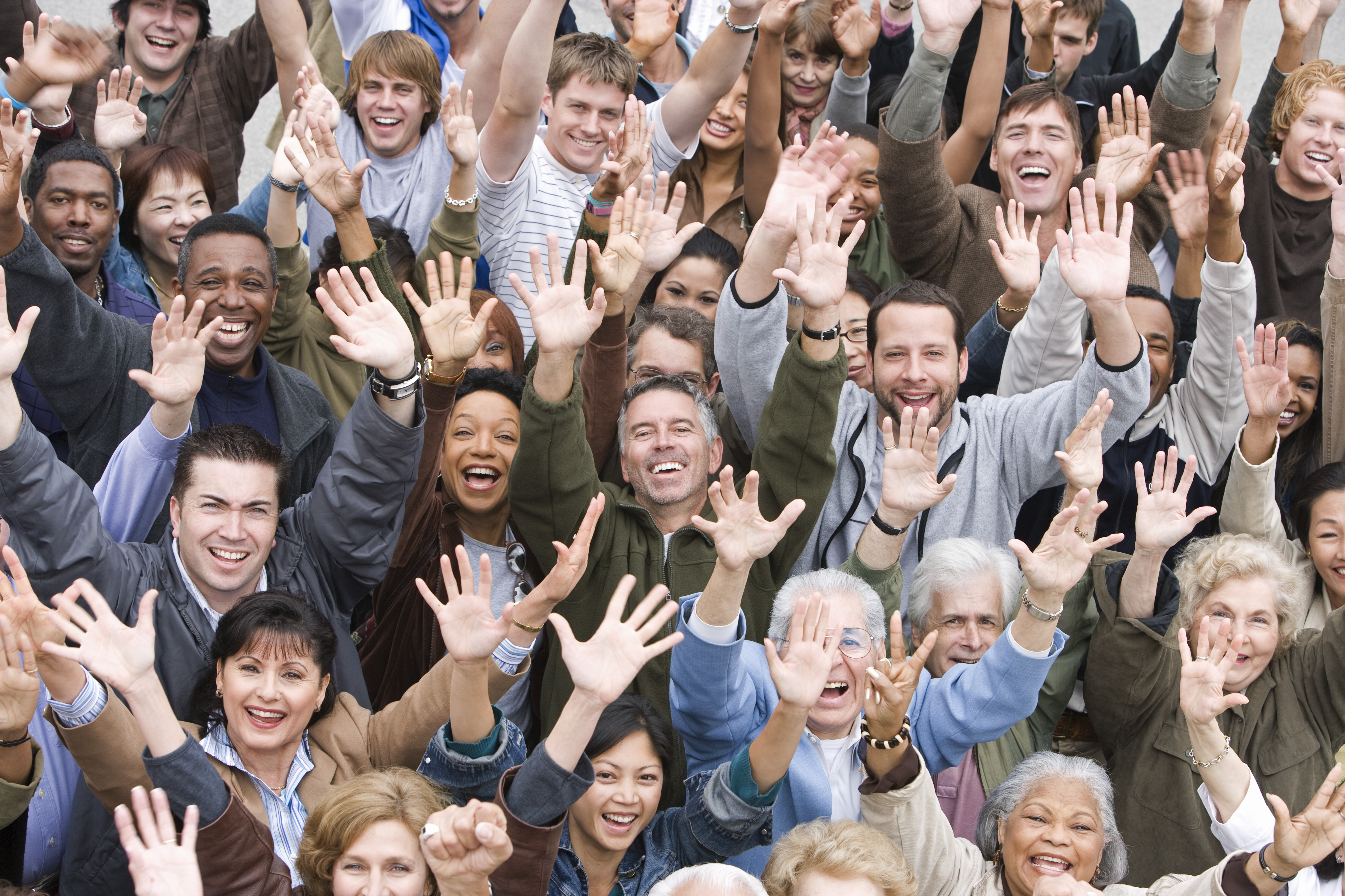 Group of people smiling up at the camera